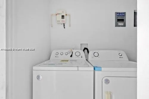 a utility room with dryer and washer