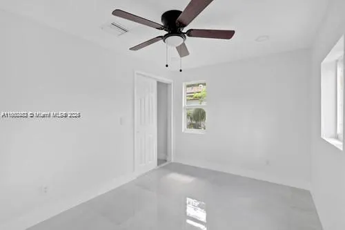 a view of an empty room with a window