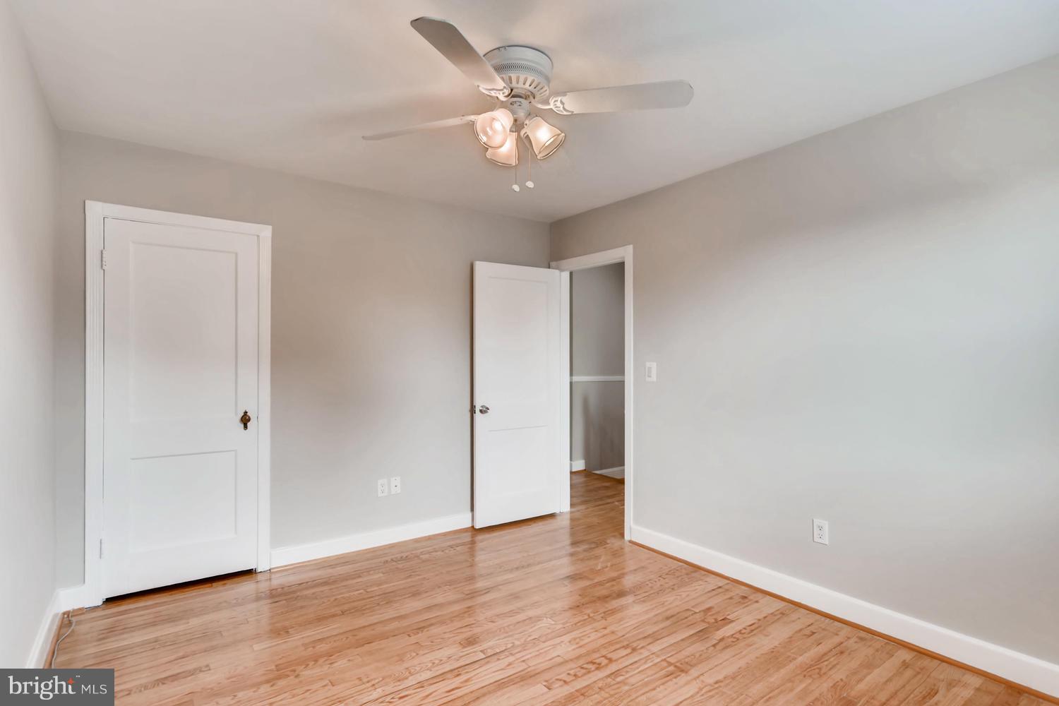 8546 Water Oak Road Baltimore, MD 21234 - Photo 13 of 28 a view of an empty room with wooden floor