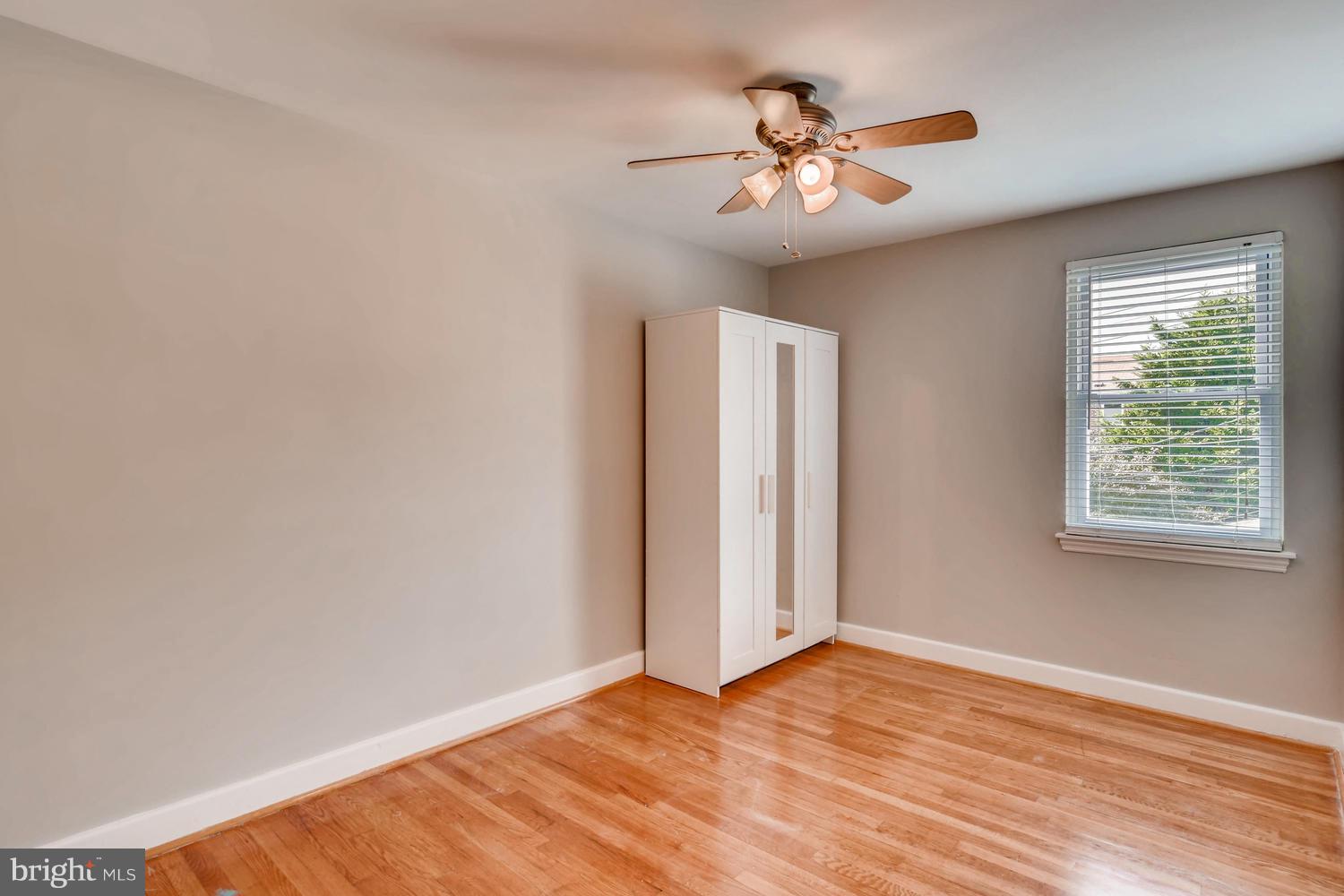 8546 Water Oak Road Baltimore, MD 21234 - Photo 18 of 28 a view of an empty room with wooden floor and a window