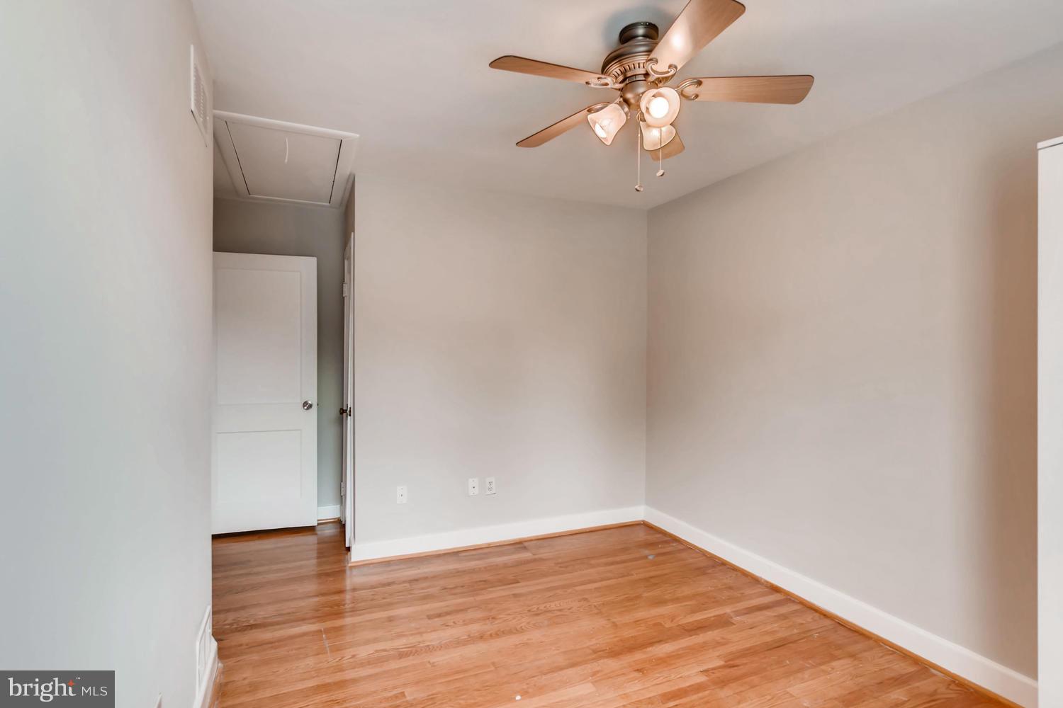8546 Water Oak Road Baltimore, MD 21234 - Photo 19 of 28 a view of an empty room with wooden floor
