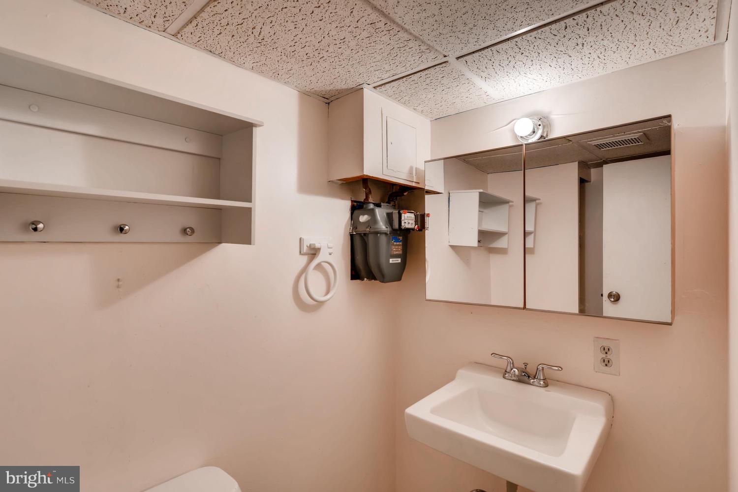 8546 Water Oak Road Baltimore, MD 21234 - Photo 24 of 28 a bathroom with a sink and a mirror
