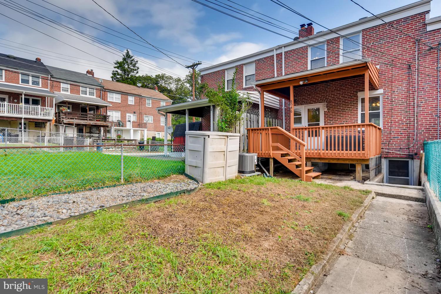 8546 Water Oak Road Baltimore, MD 21234 - Photo 27 of 28 a front view of a house with a garden and chairs