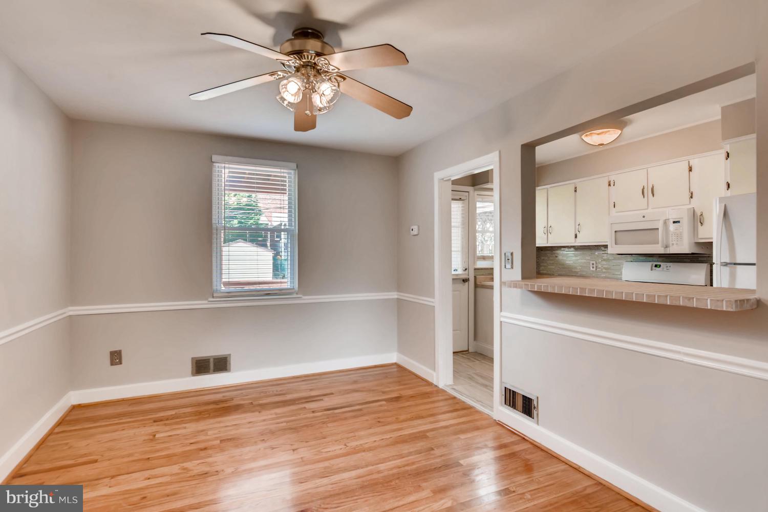 8546 Water Oak Road Baltimore, MD 21234 - Photo 5 of 28 a view of a kitchen with kitchen island a sink stainless steel appliances and cabinets