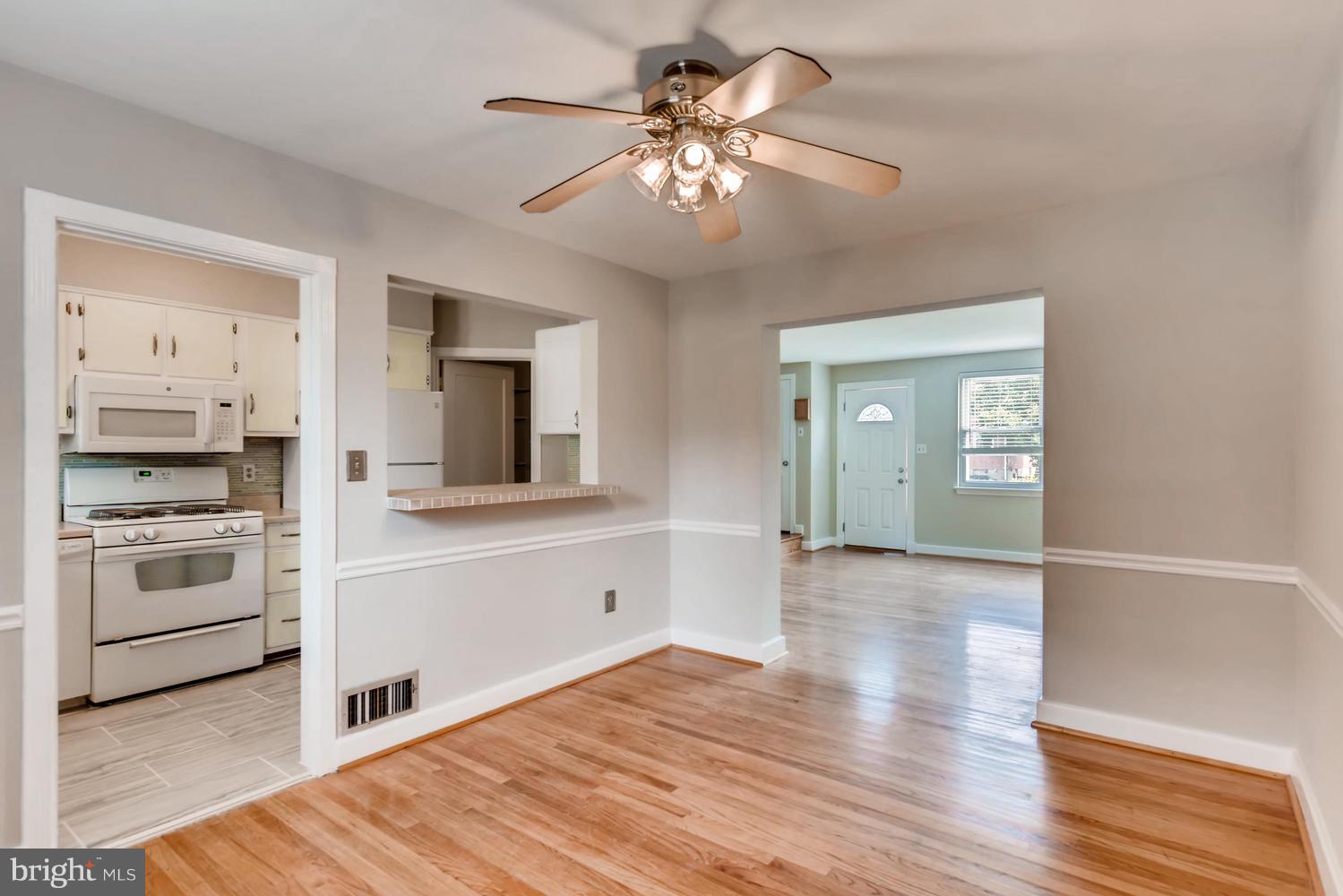 8546 Water Oak Road Baltimore, MD 21234 - Photo 6 of 28 a view of a kitchen with a sink and a stove top oven