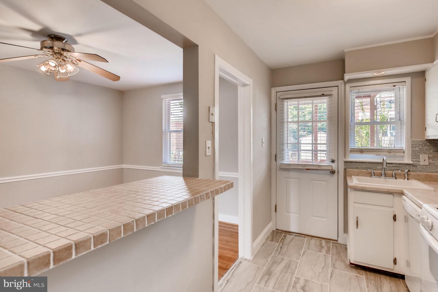 8546 Water Oak Road Baltimore, MD 21234 - Photo 9 of 28 a bedroom with a bed and a chandelier