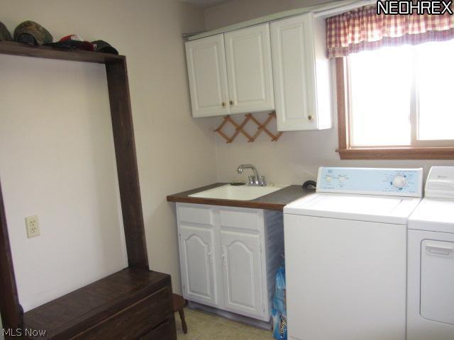 3859 Dawley Road Ravenna, OH 44266 - Photo 13 of 19 1st floor laundry and mud room has cabinets, sink and room to sit down and take off your shoes and stay a while.