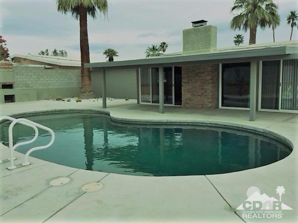 71547 Mirage Road Rancho Mirage, CA 92270 - Photo 17 of 17 a view of a swimming pool with a garden