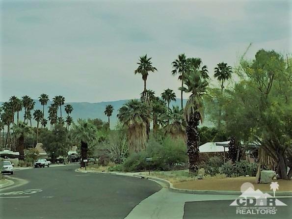 71547 Mirage Road Rancho Mirage, CA 92270 - Photo 4 of 17 a view of a street with a building in the background