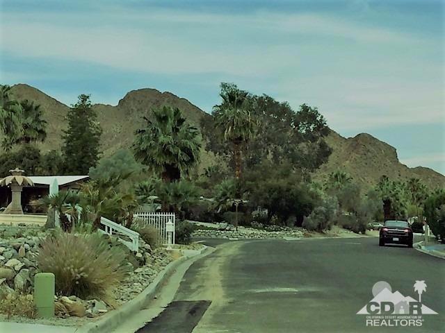 71547 Mirage Road Rancho Mirage, CA 92270 - Photo 5 of 17 a view of a garden with a lake