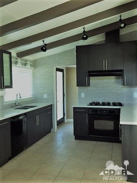 71547 Mirage Road Rancho Mirage, CA 92270 - Photo 7 of 17 a kitchen with a sink and a stove top oven