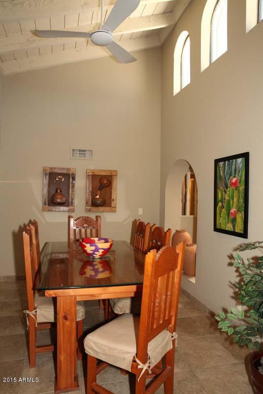 7249 East Maverick Road Scottsdale, AZ 85258 - Photo 11 of 26 a living room with furniture and a potted plant
