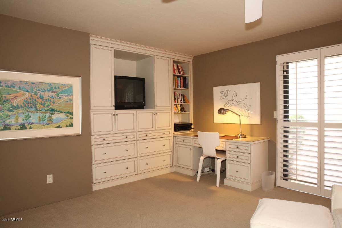 7249 East Maverick Road Scottsdale, AZ 85258 - Photo 17 of 26 a room with furniture and a flat screen tv