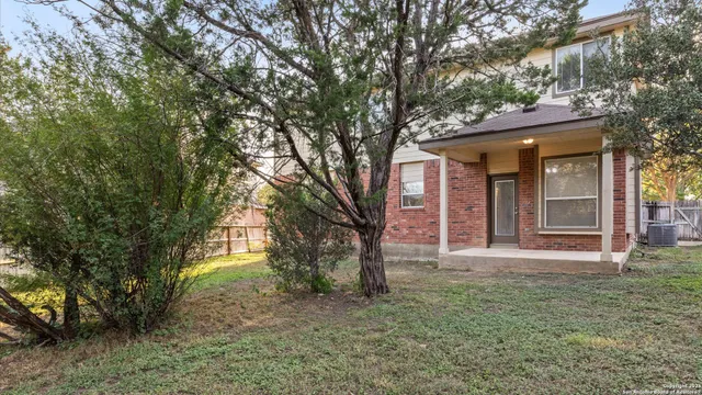 front view of a house with a trees