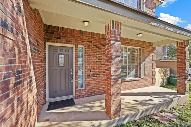 a view of a brick building with many windows
