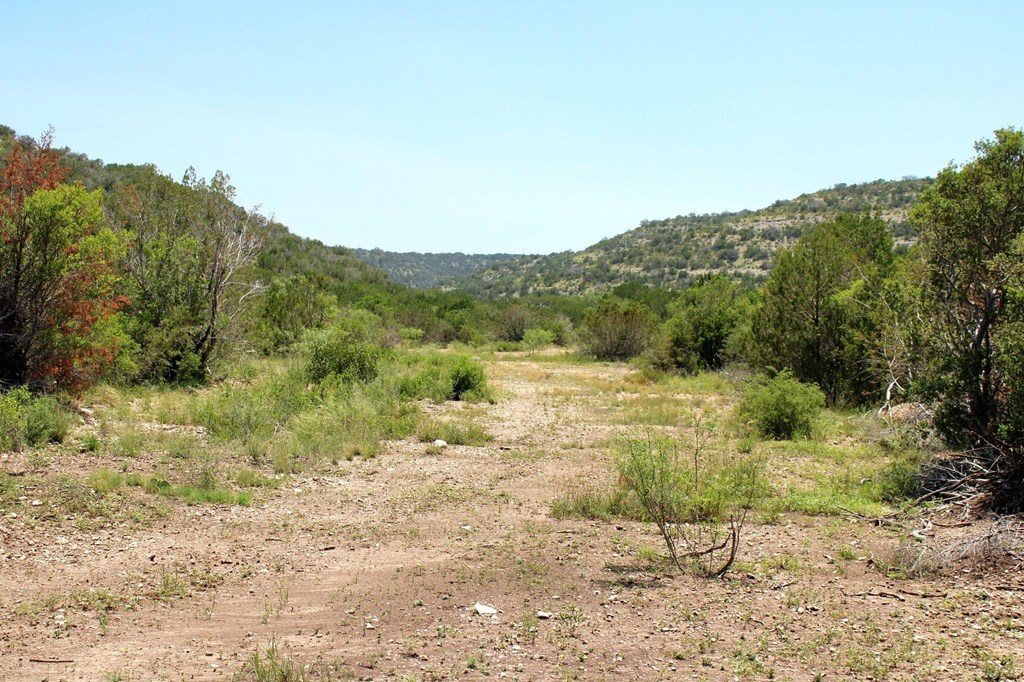 2519 Widmark Road Comstock, TX 78837 - Photo 32 of 49 a view of a lake with a mountain