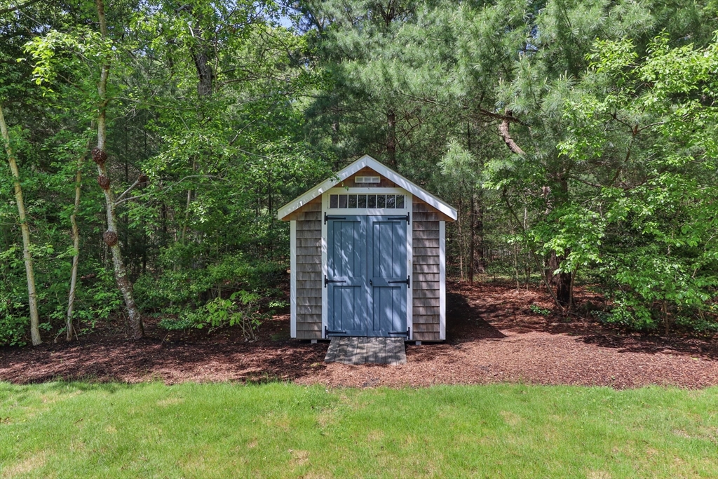 5 Main Sail Drive Sandwich, MA 02644 - Photo 29 of 33 a front view of house with a garden