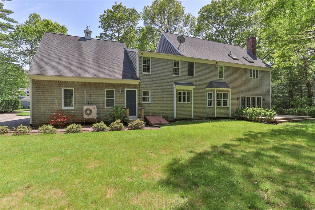 5 Main Sail Drive Sandwich, MA 02644 - Photo 30 of 33 front view of a house with a garden