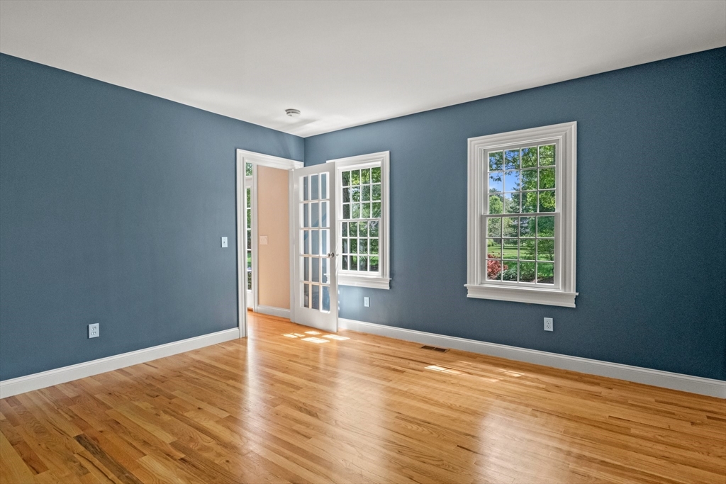 5 Main Sail Drive Sandwich, MA 02644 - Photo 4 of 33 a view of an empty room with wooden floor and a window