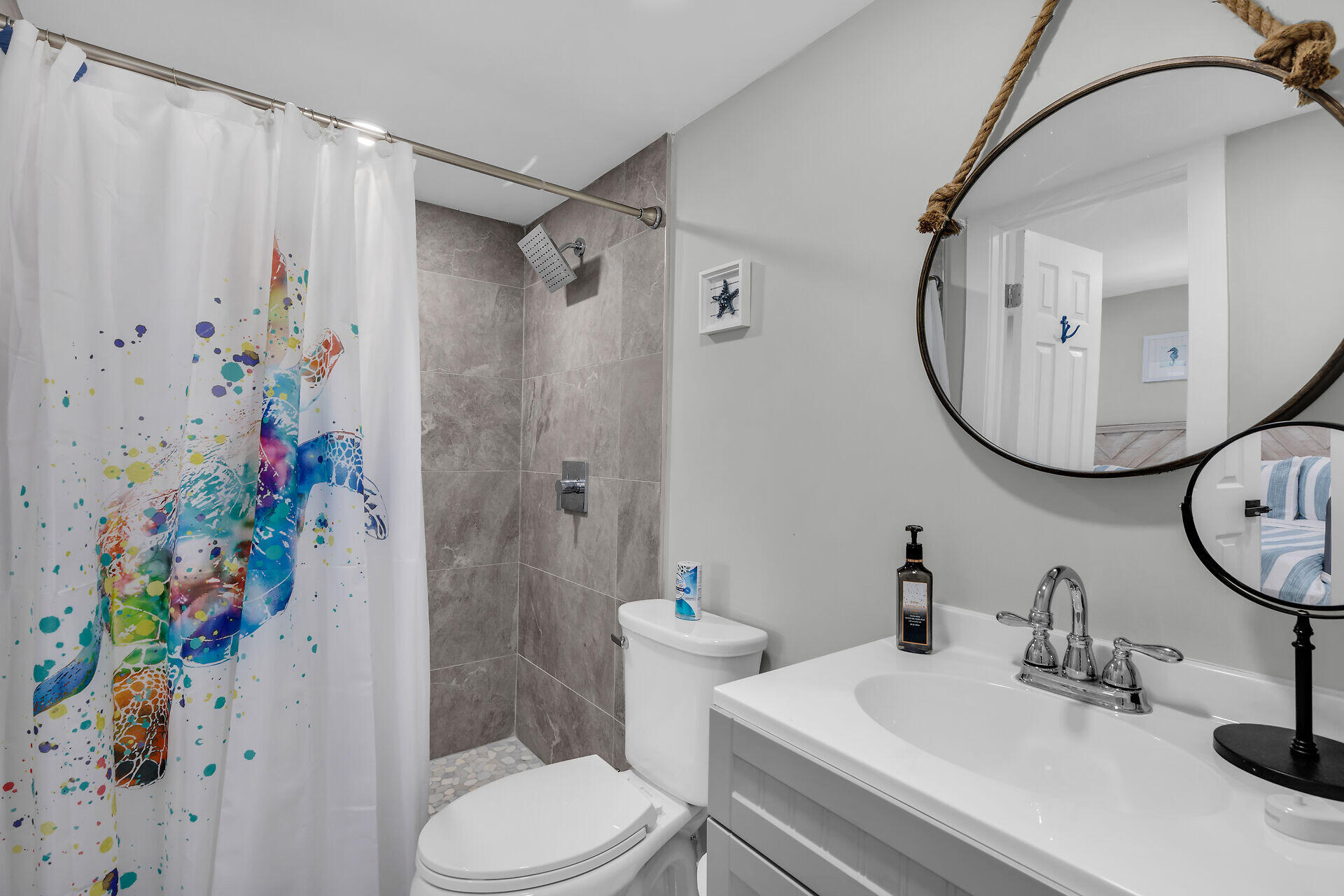 1007 Hialeah Lane Key Largo, FL 33037 - Photo 13 of 41 a bathroom with a sink a toilet and a mirror