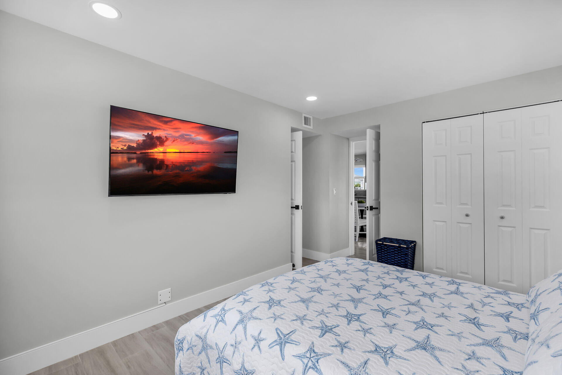 1007 Hialeah Lane Key Largo, FL 33037 - Photo 14 of 41 a bedroom with a bed and a flat screen tv