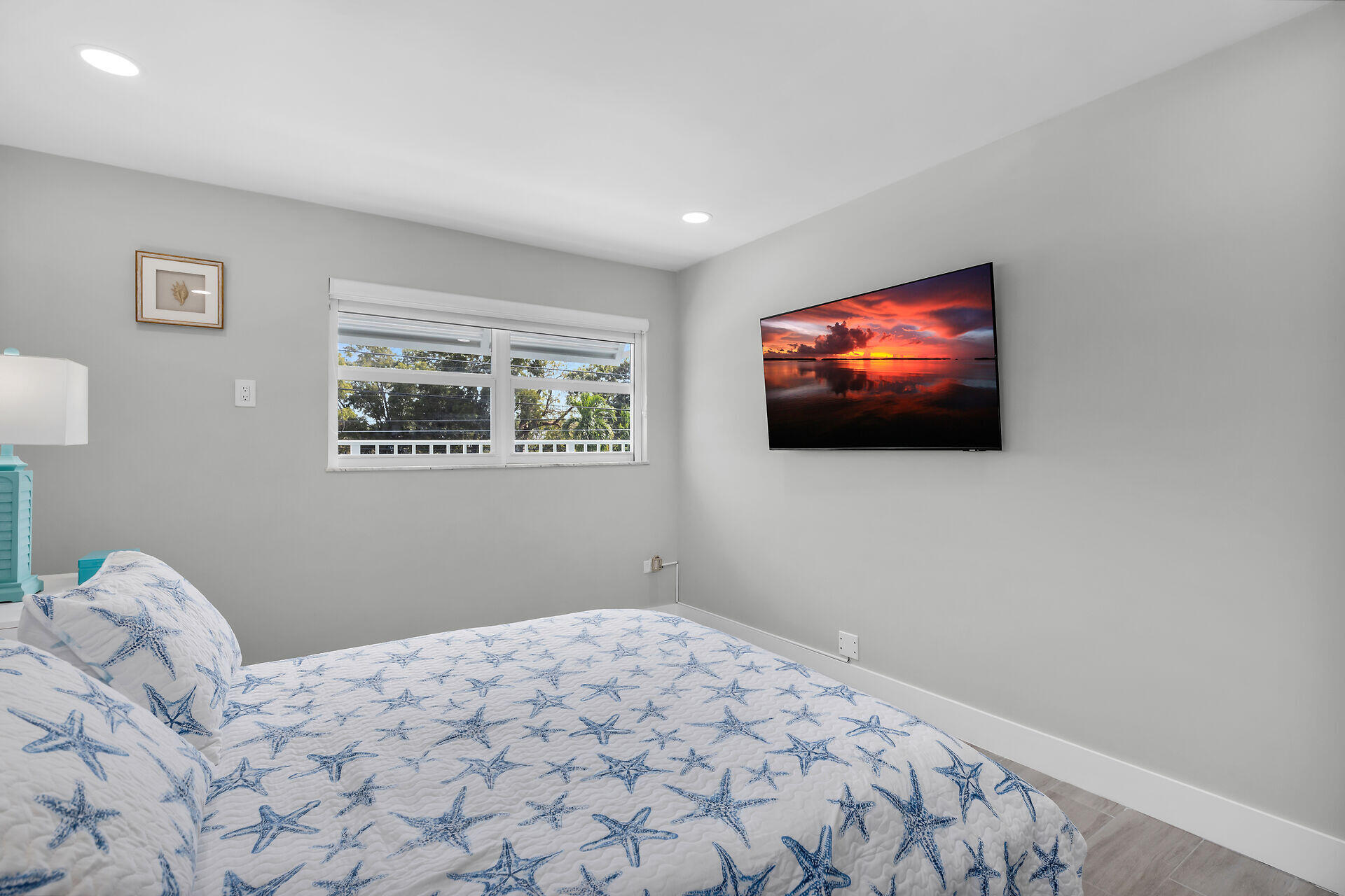 1007 Hialeah Lane Key Largo, FL 33037 - Photo 16 of 41 a bedroom with a bed and a flat screen tv