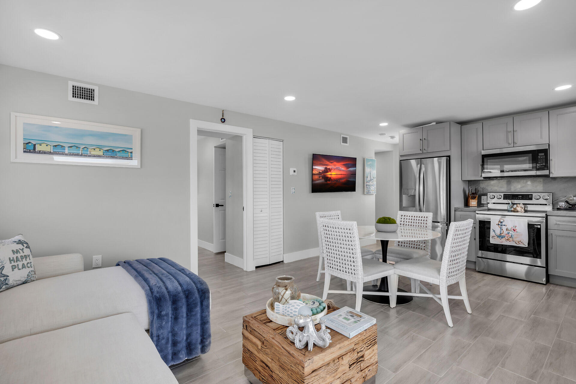 1007 Hialeah Lane Key Largo, FL 33037 - Photo 20 of 41 a living room with furniture a flat screen tv and kitchen view