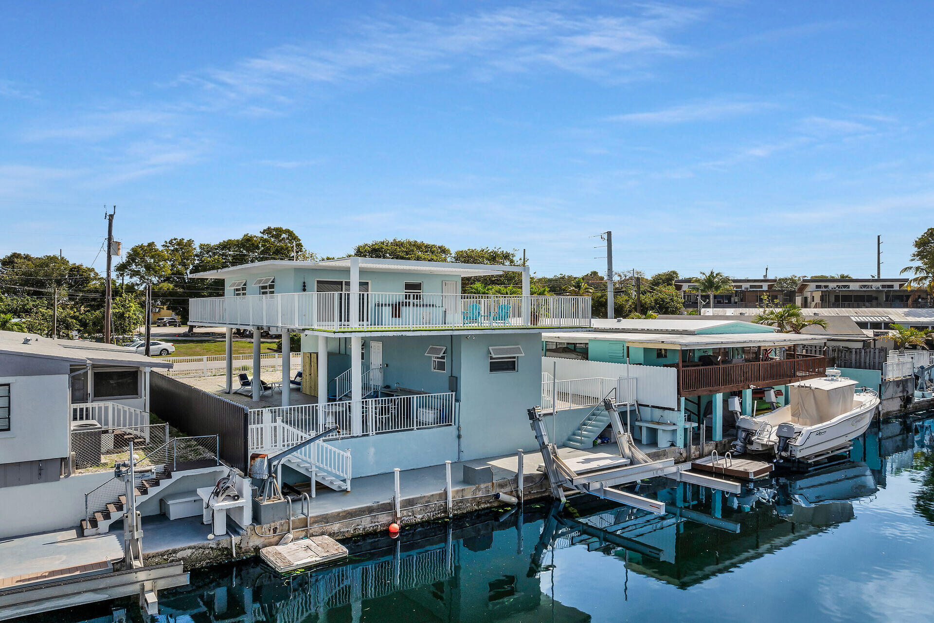1007 Hialeah Lane Key Largo, FL 33037 - Photo 37 of 41 a view of a chairs and table in a terrace