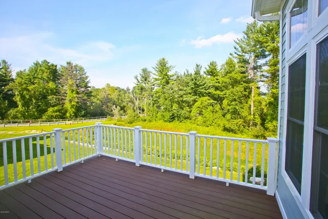 a view of a patio with a dining table and chairs