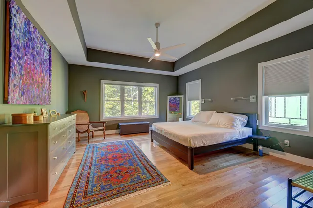 a kitchen with stainless steel appliances granite countertop a sink refrigerator and cabinets