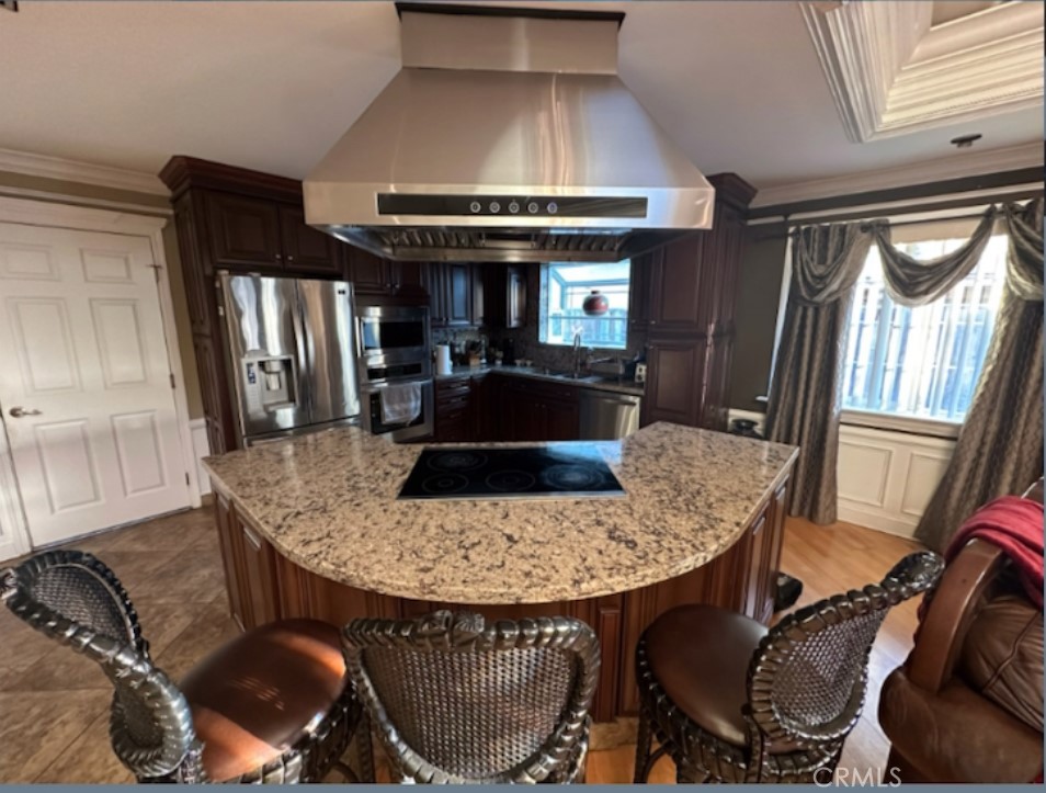 a kitchen with a table chairs and a refrigerator