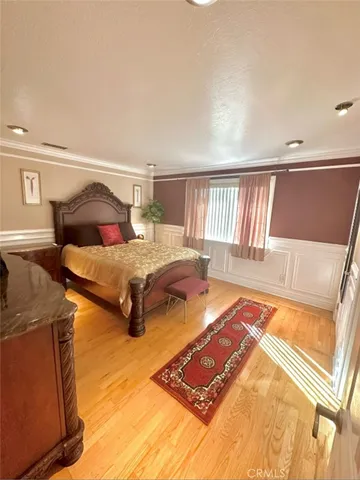 a living room with granite countertop furniture and a flat screen tv