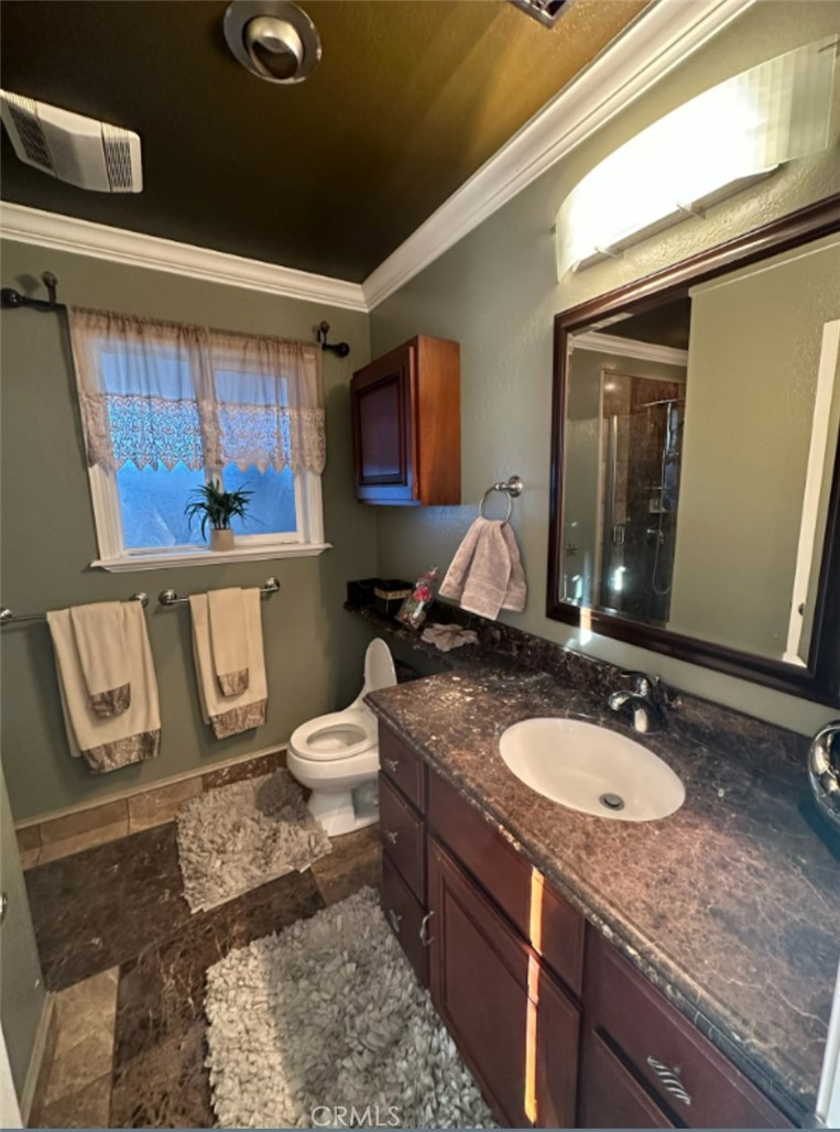 48 Jeanette Way Watsonville, CA 95076 - Photo 9 of 14 a bathroom with a granite countertop sink a toilet a mirror and bathtub