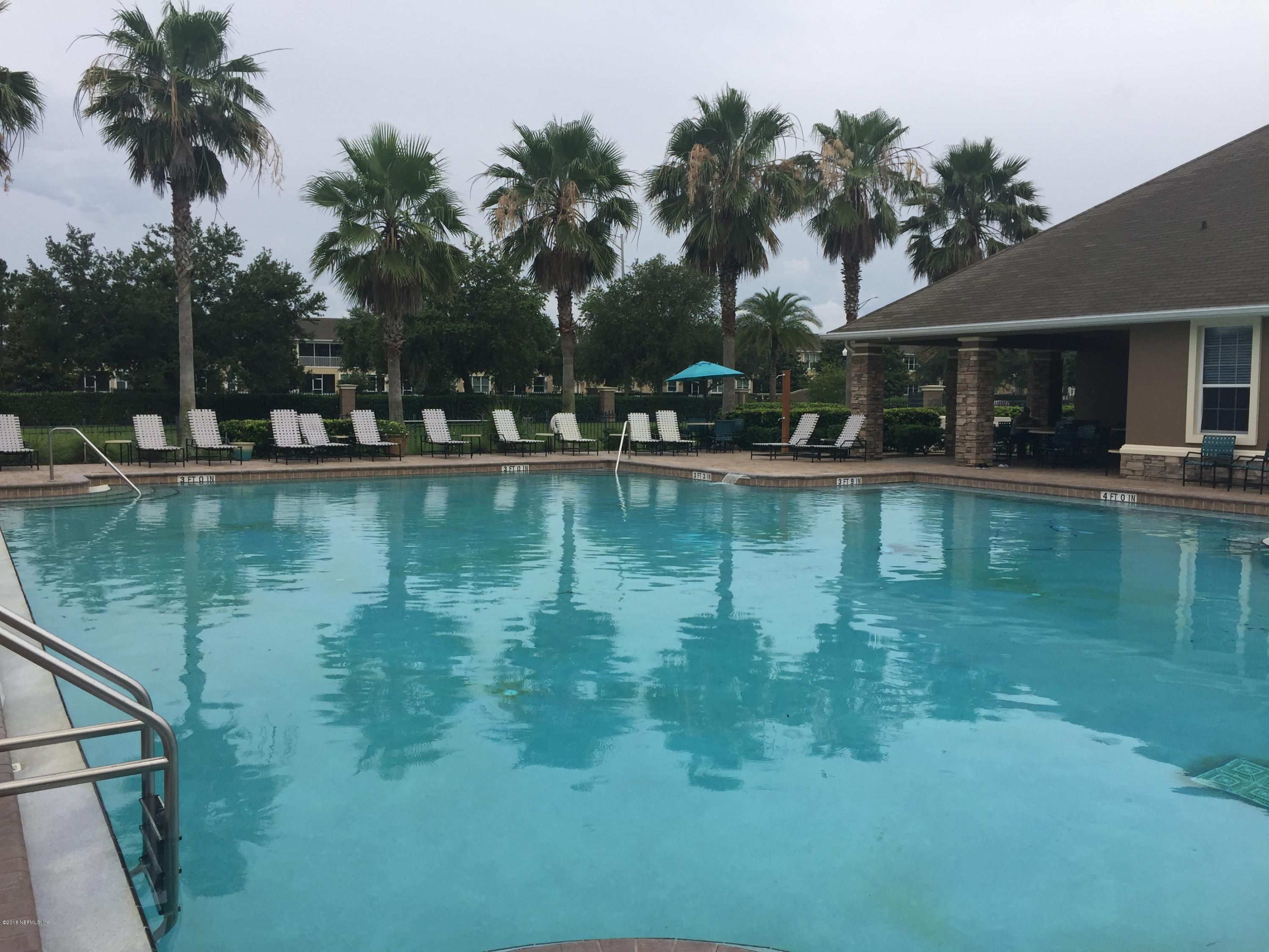 12978 Spring Rain Road Jacksonville, FL 32258 - Photo 17 of 17 a view of a swimming pool with a patio