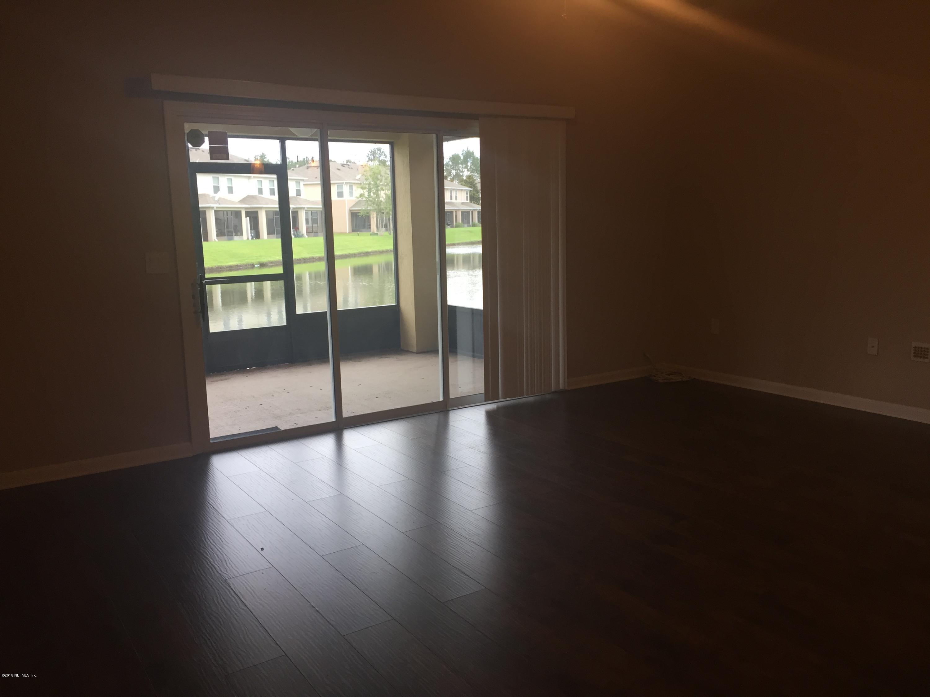 12978 Spring Rain Road Jacksonville, FL 32258 - Photo 3 of 17 a view of empty room with wooden floor and fan