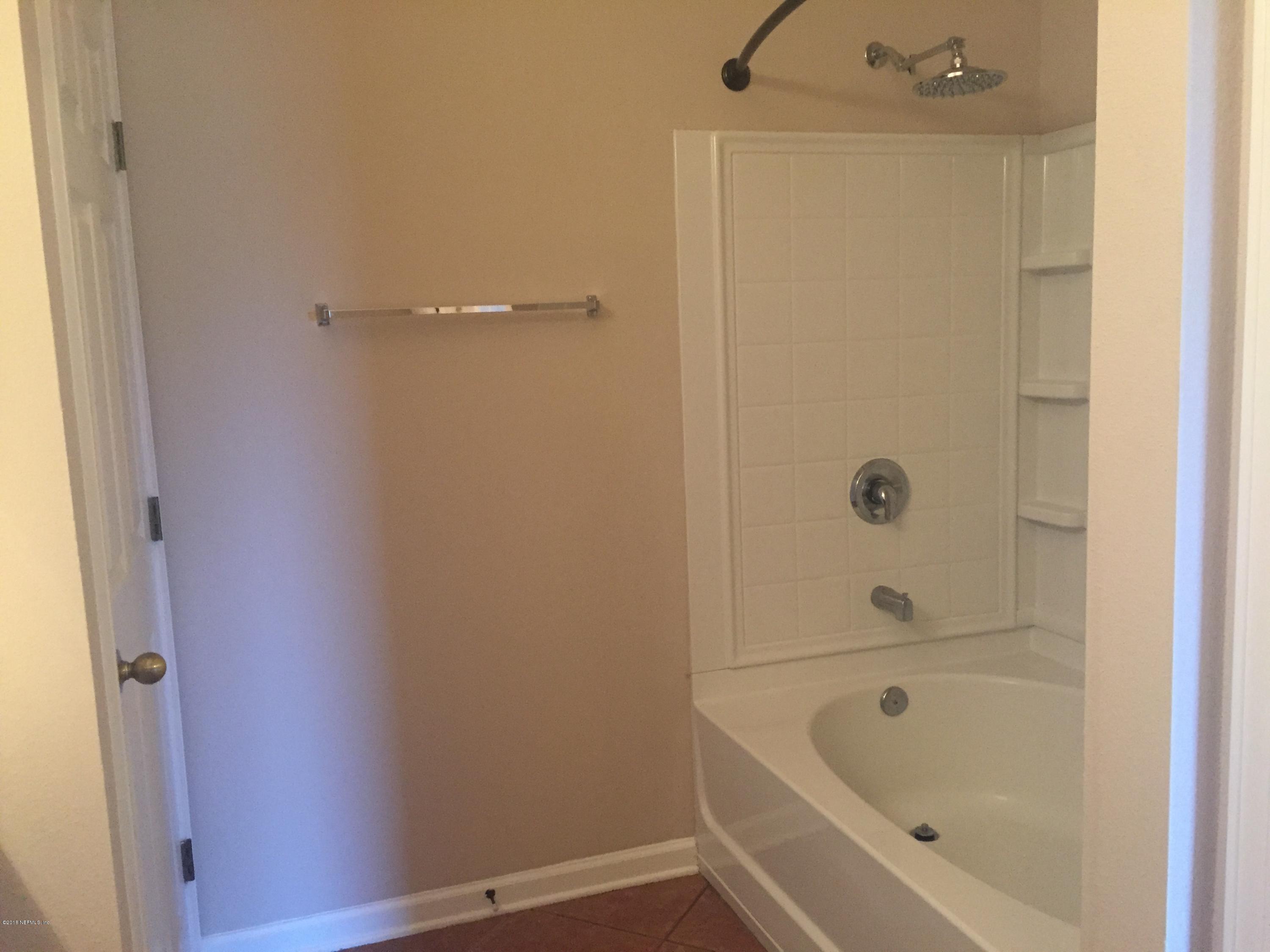 12978 Spring Rain Road Jacksonville, FL 32258 - Photo 9 of 17 a bathroom with a tub