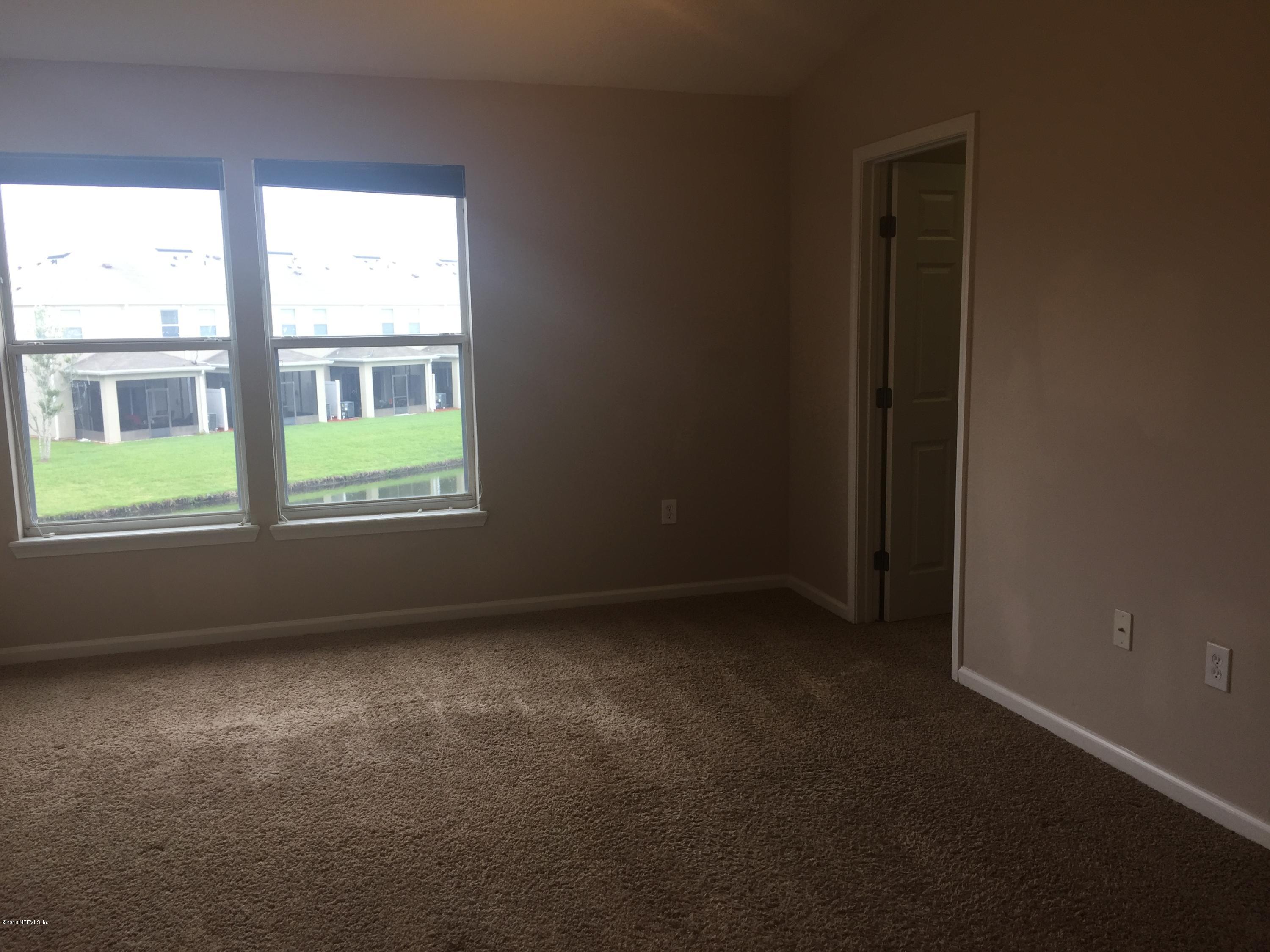 12978 Spring Rain Road Jacksonville, FL 32258 - Photo 10 of 17 an empty room with a window
