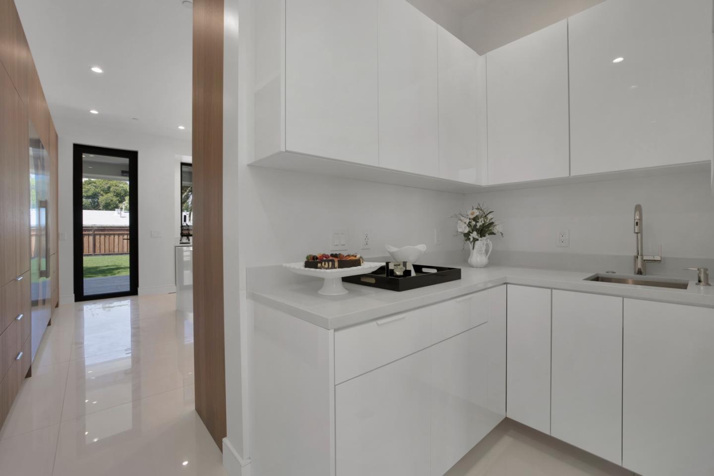 729 Filbert Avenue Campbell, CA 95008 - Photo 20 of 56 a kitchen with white cabinets and appliances