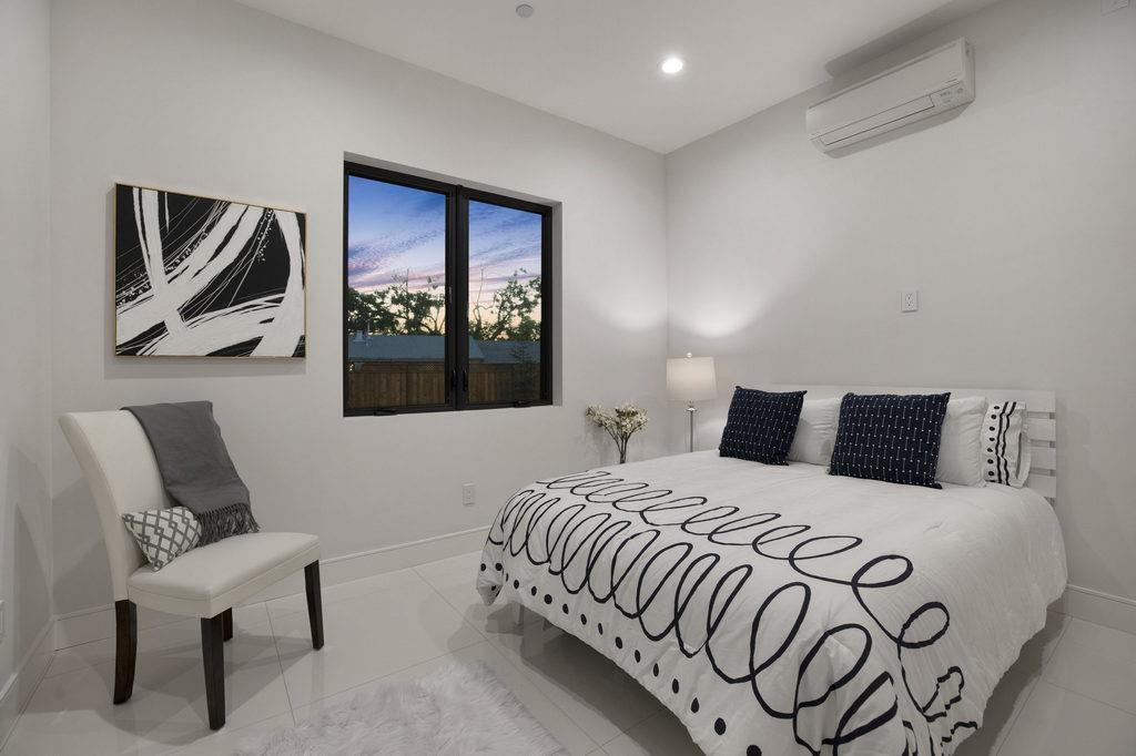 729 Filbert Avenue Campbell, CA 95008 - Photo 37 of 56 a bedroom with a bed and a painting on the wall