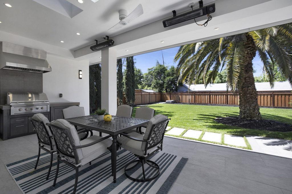 729 Filbert Avenue Campbell, CA 95008 - Photo 42 of 56 a view of a patio with a table chairs and a yard