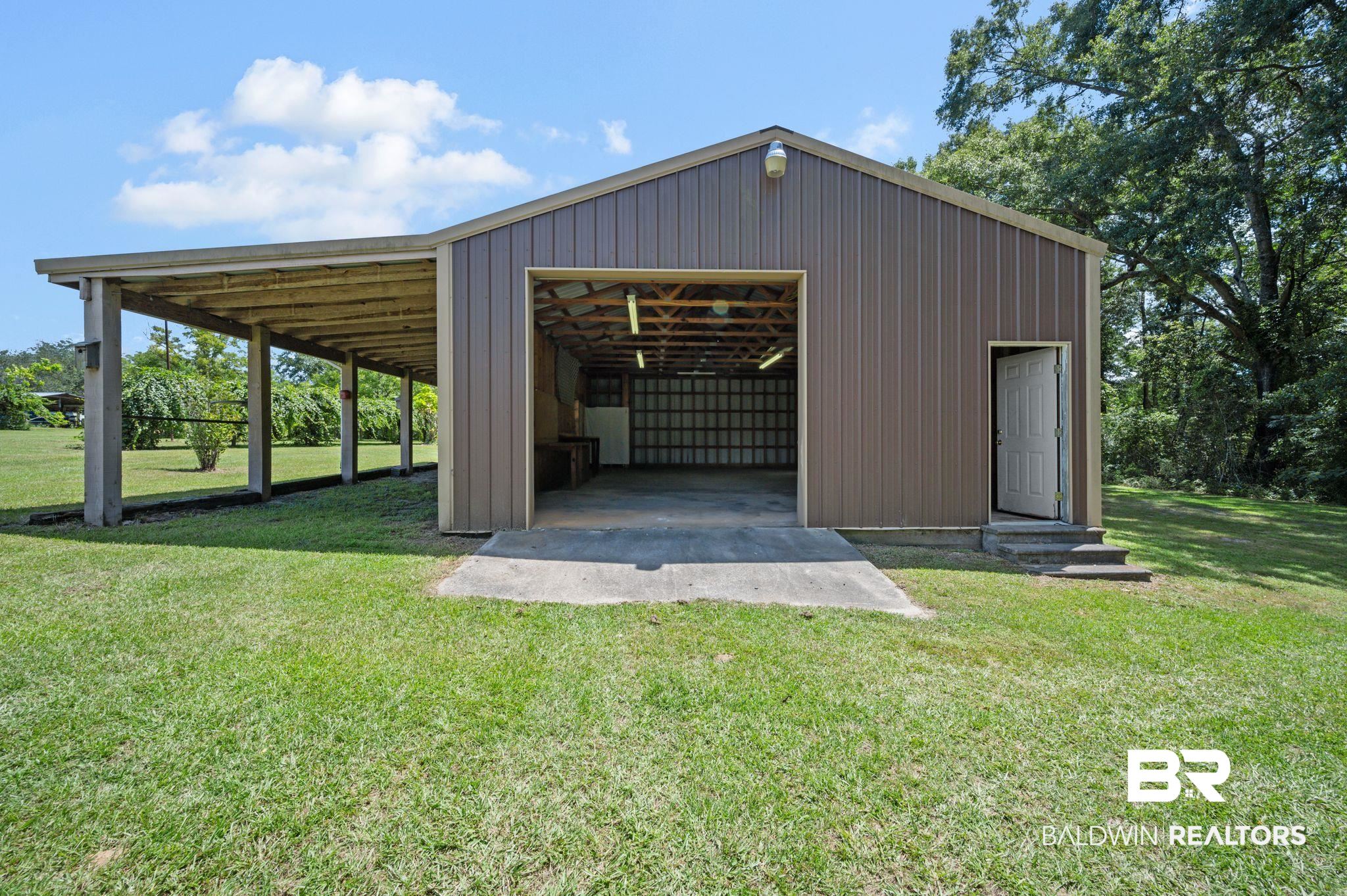 15880 Pine Grove Rd Extension West Bay Minette, AL 36507 - Photo 10 of 44 View of outdoor structure featuring a yard
