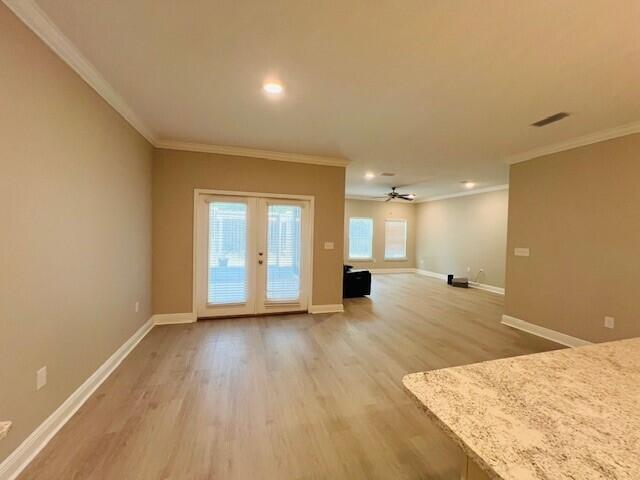 201 Lightning Bug Lane, Unit LOT 58 Freeport, FL 32439 - Photo 13 of 40 a view of an empty room with wooden floor and a window