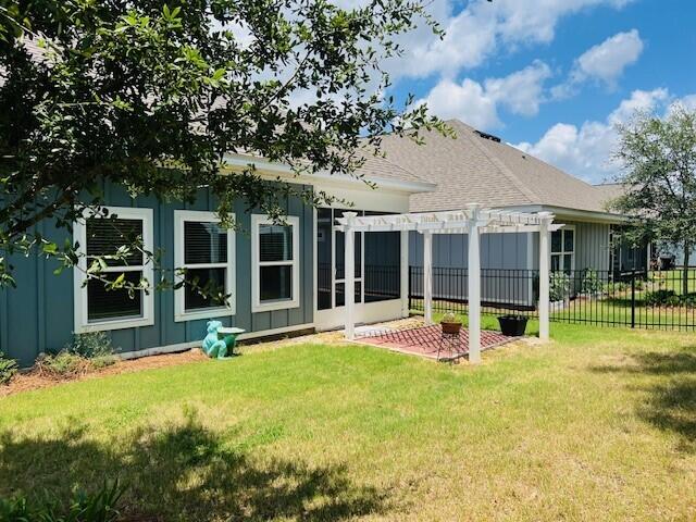 201 Lightning Bug Lane, Unit LOT 58 Freeport, FL 32439 - Photo 4 of 40 a view of a house with backyard porch and sitting area