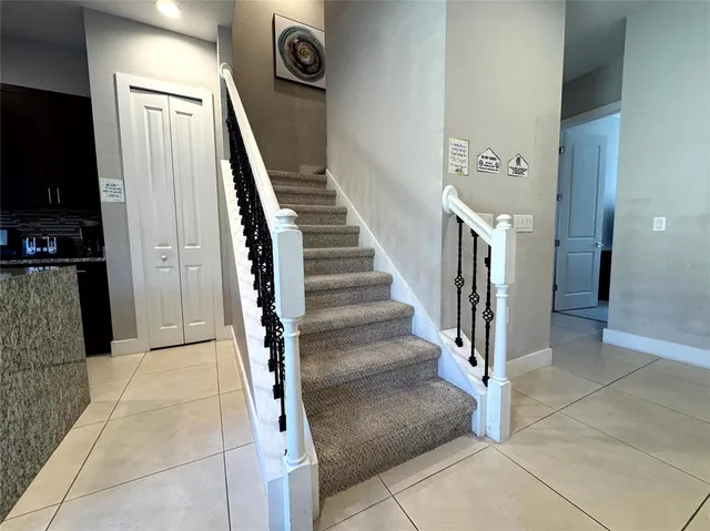 a view of entryway and hall with a living room