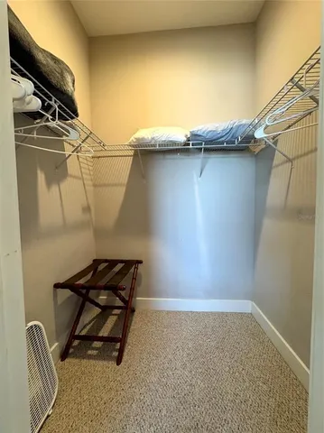 a view of storage and utility room with racks on the wall