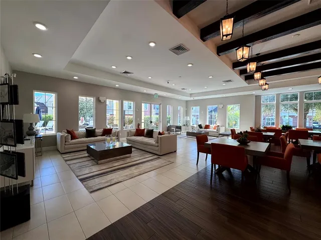 a living room with lots of furniture and a wooden floor