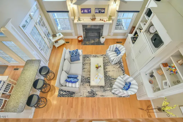 a view of a dining room with furniture large windows and outside view