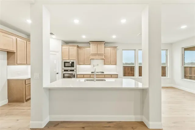 a view of an empty room with a fireplace
