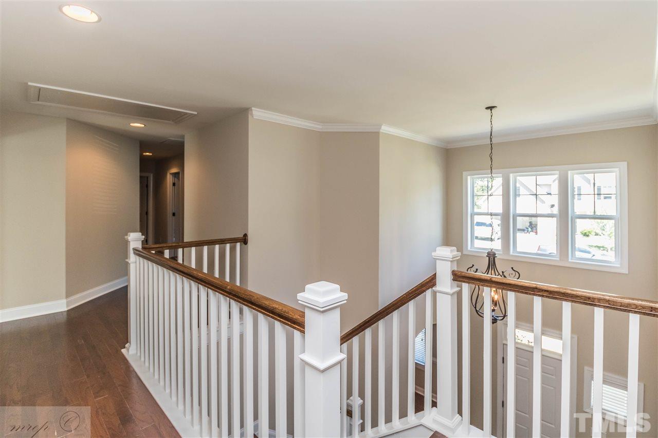 3508 Bloomfield Way Raleigh, NC 27616 - Photo 11 of 24 a view of a hallway with windows and stairs