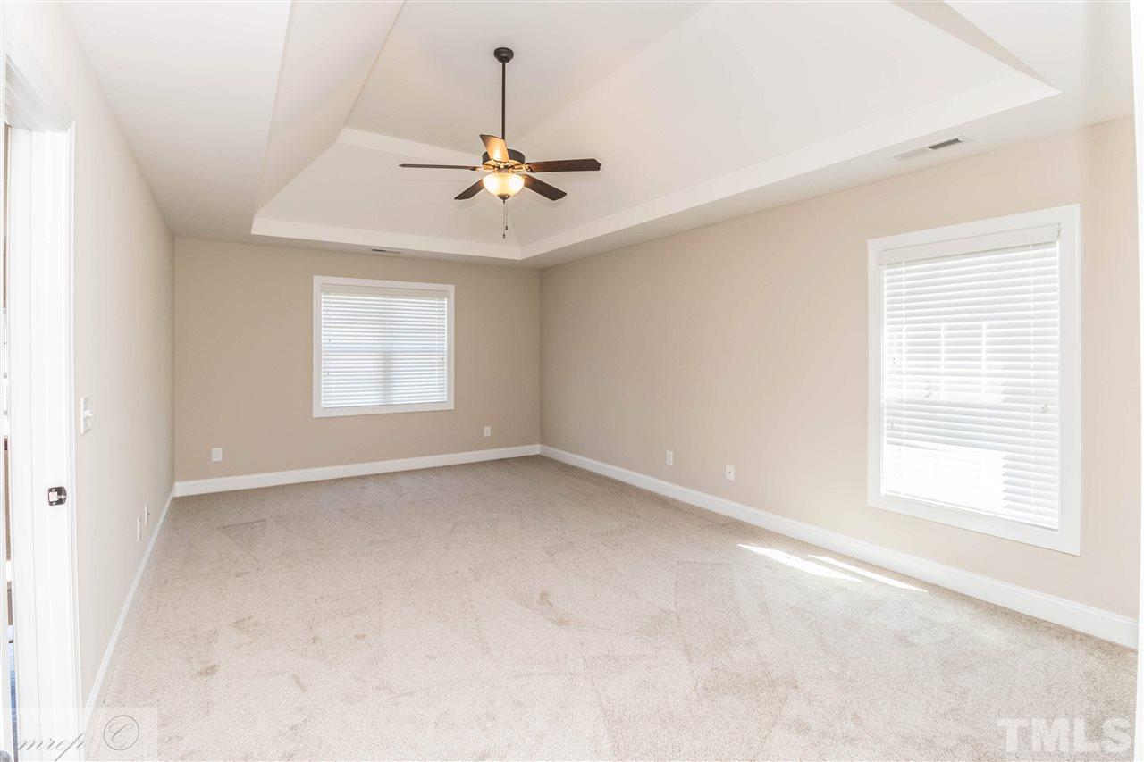 3508 Bloomfield Way Raleigh, NC 27616 - Photo 13 of 24 an empty room with windows and fan